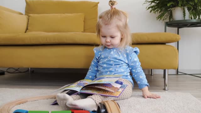 Cute baby girl playing with her Toy's