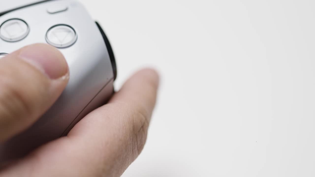 Studio Close Up Shot Of Hands Playing Video Game Controller