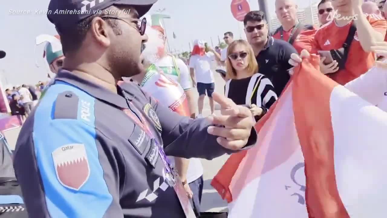 Qatari Police Confront Female Fan Wearing 'Woman, Life, Freedom' T-Shirt at Iran Match