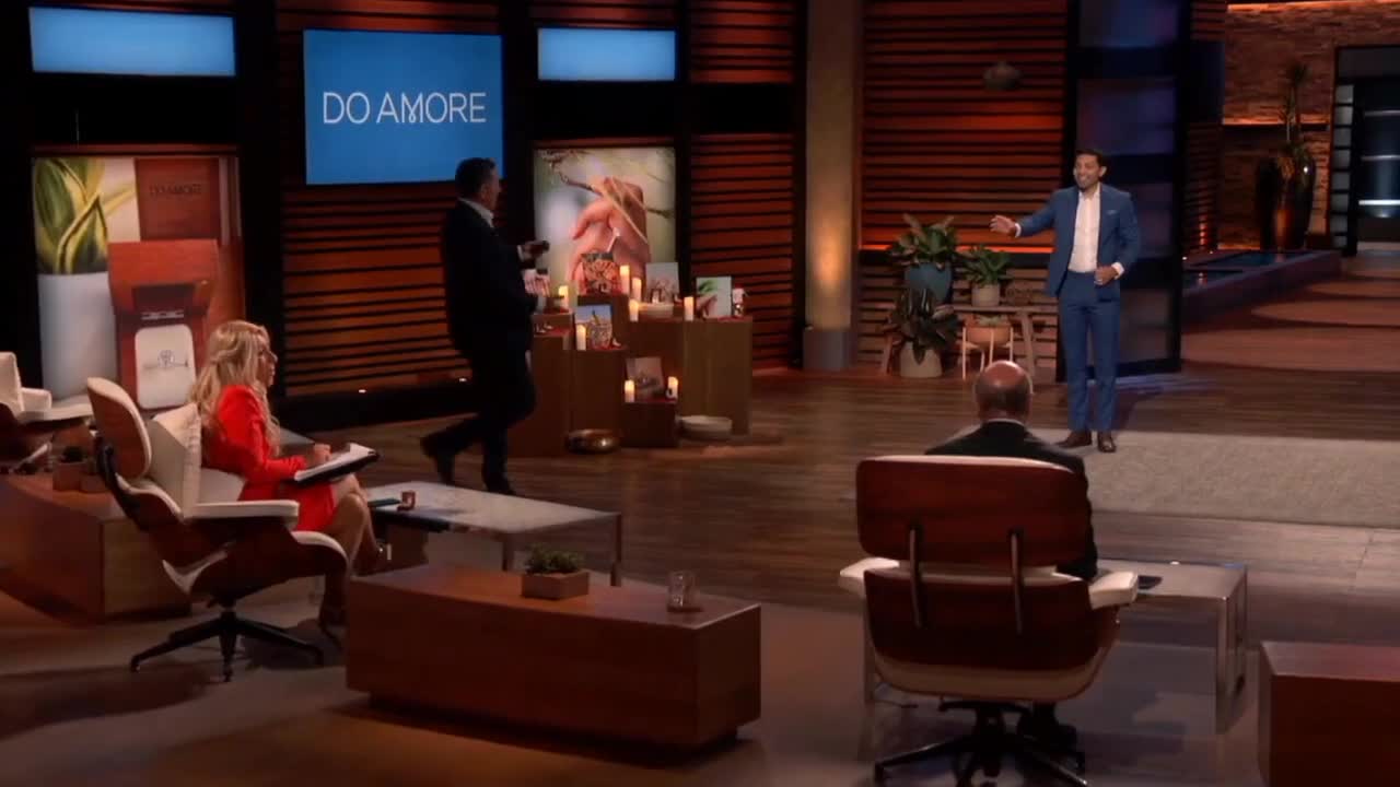 Shark kneeled down for an enterprenuer in shark tank