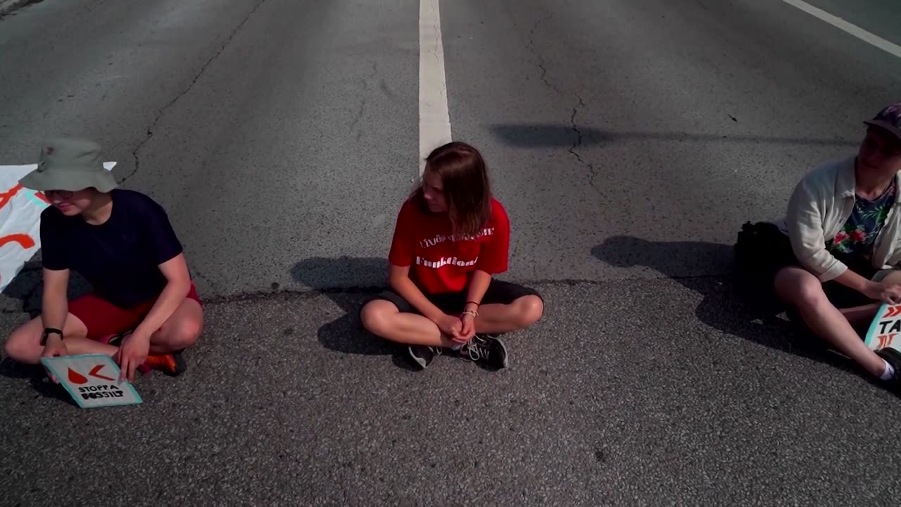 Police carry Greta Thunberg from oil port protest in Malmo