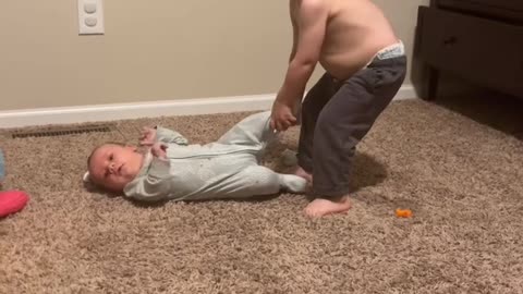 Little Boy Tries to Take Brother For a Walk