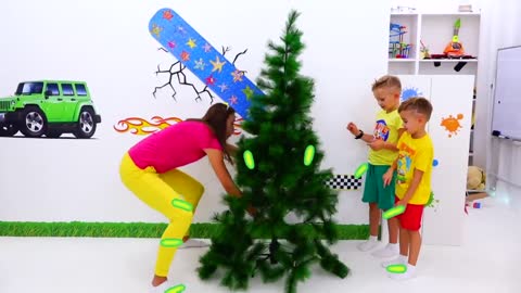 Vlad and Niki pretend play and decorate the Christmas tree
