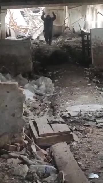 Ukrainian Forces cautiously taking Russian combatants into custody.