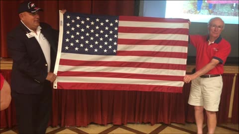 Villagers for Trump - Marine unfolds historic flag.