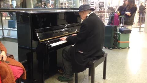 Cool performance from an elderly man at the airport