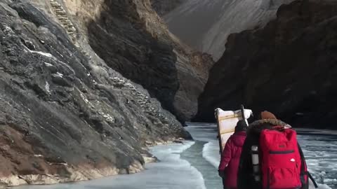 Group Of People Hike Glacier And Witness Ice-covered Stream In India