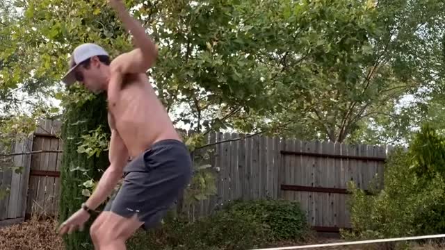 Man Dribbles Basketball While Balancing on Slack Line And Balance Boards