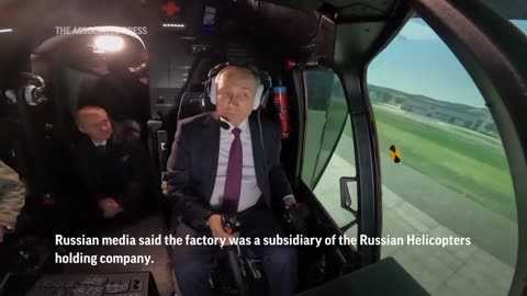 Putin visits helicopter factory in Siberia