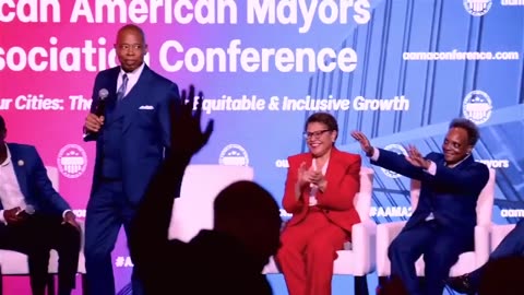 Eric Adams, the Democratic Mayor of New York City, displays his signature 'walk' as Lori Lightfoot