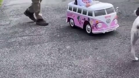 Girl in toy car