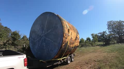 Oversized load! Loading and hauling giant storage tanks.