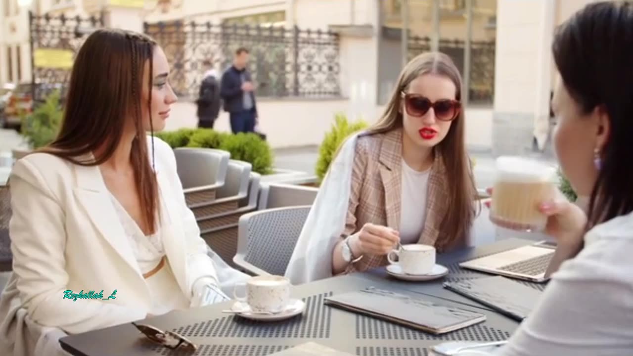 Three young women drink coffee, share events, smile, and have fun with rai music