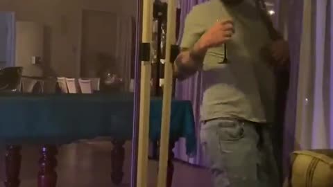 Man with Beverage Bested By Screen Door