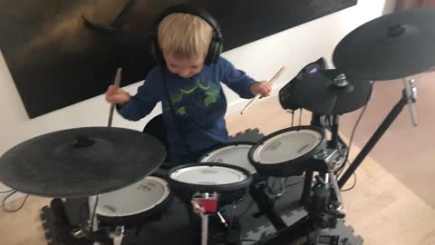 Kid enjoying with drum |