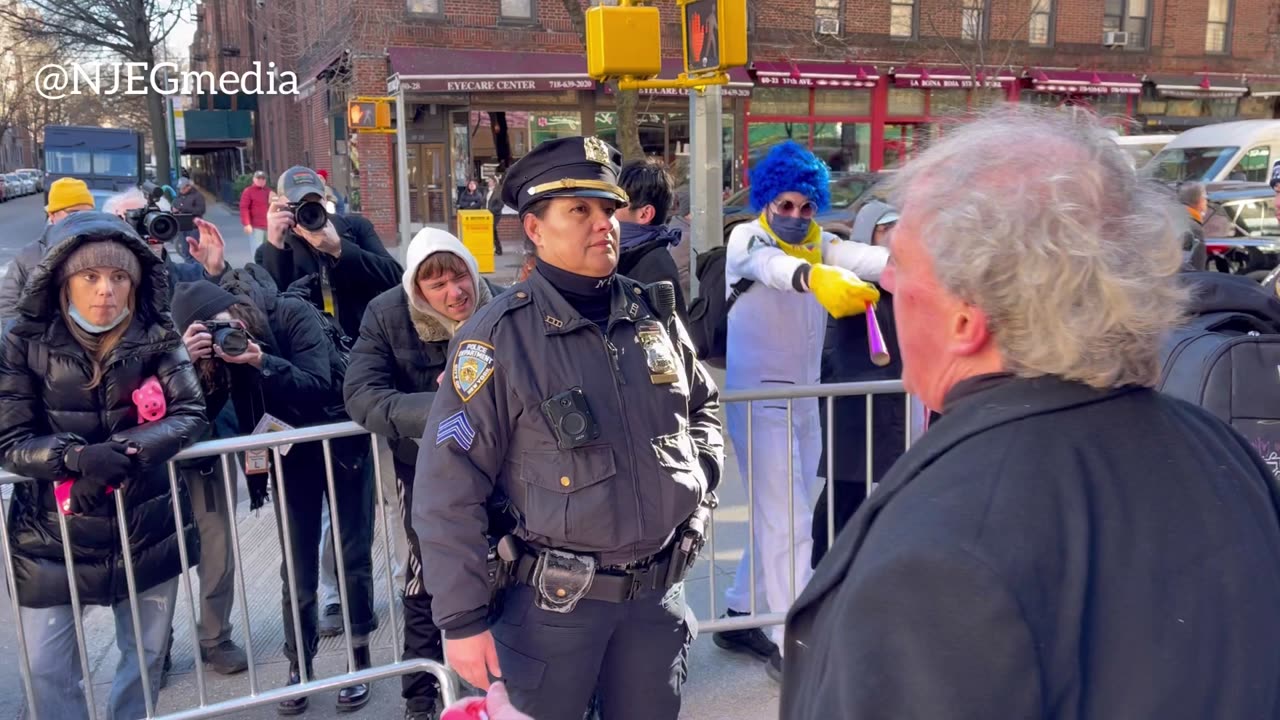 A protestor with a bullhorn faces-off Drag Queen Story Hour supporters in Jackson Heights, Queens