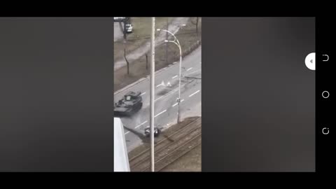 Russian soldiers tank over a moving vehicle