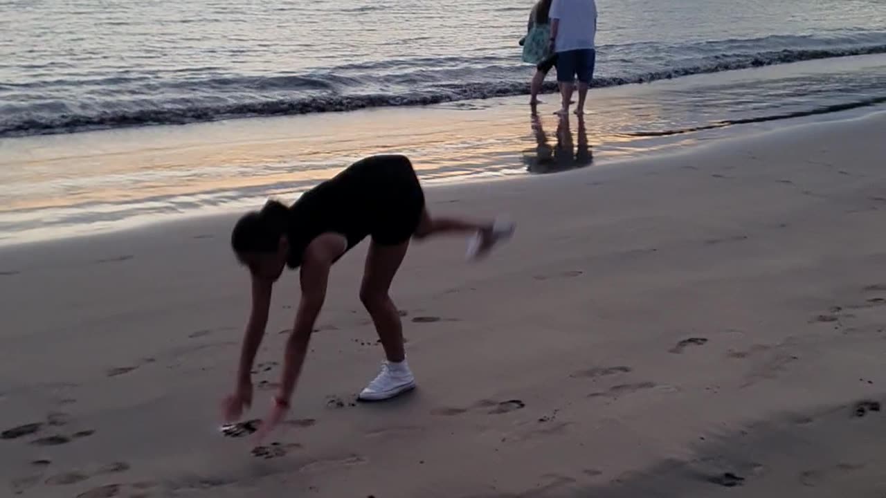 Gymnastics on the beach by Ella Brealy