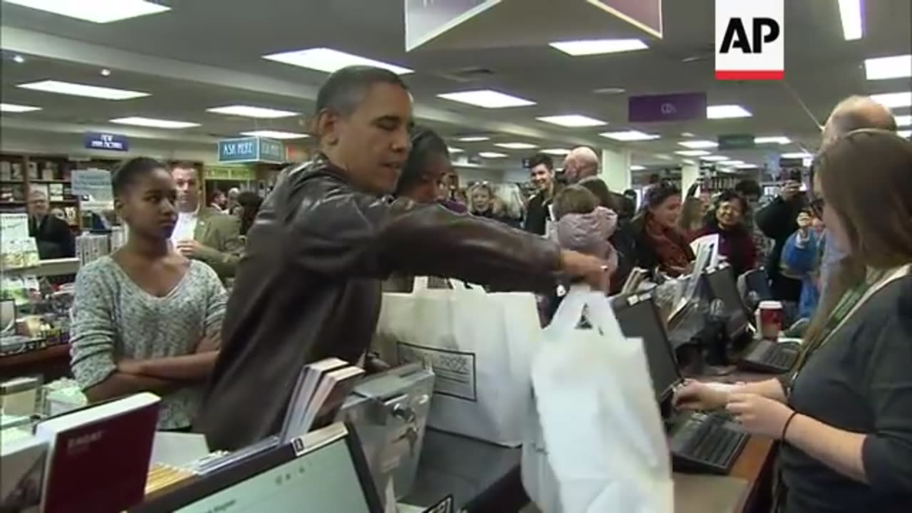 President Obama and daughters Malia and Sasha dropped in Saturday at Washington's Politics and Prose