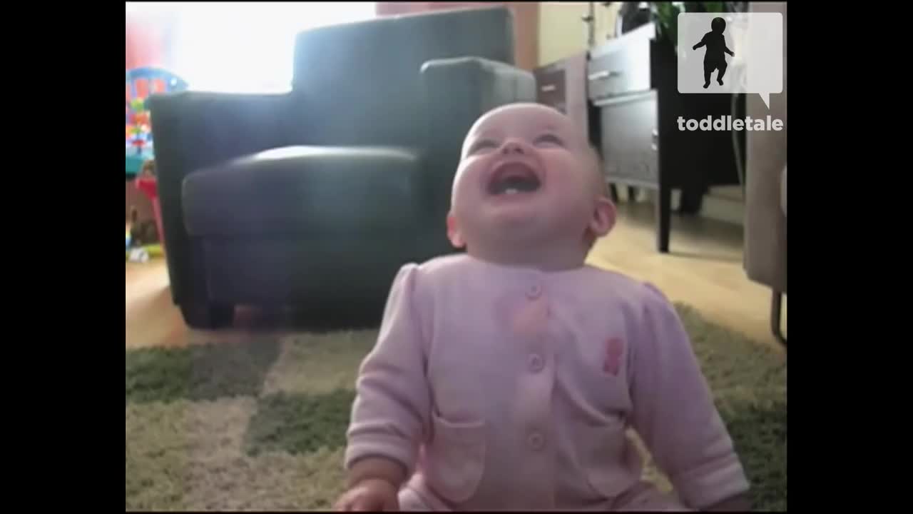 Baby Girl Laughing Hysterically at Dog Eating Popcorn