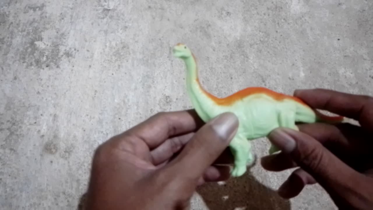 playing with the child's dinosurus