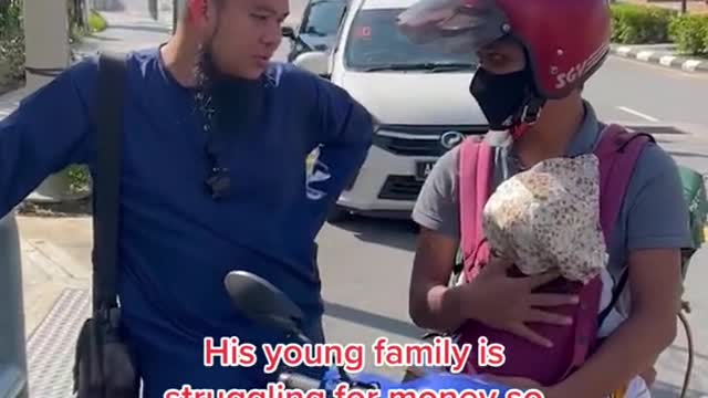 Malaysian GrabFood rider carries toddler along for deliveries