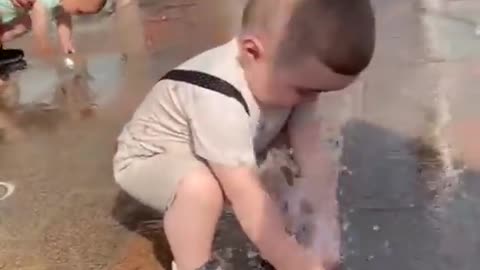 Toddler Surprised By Fountain