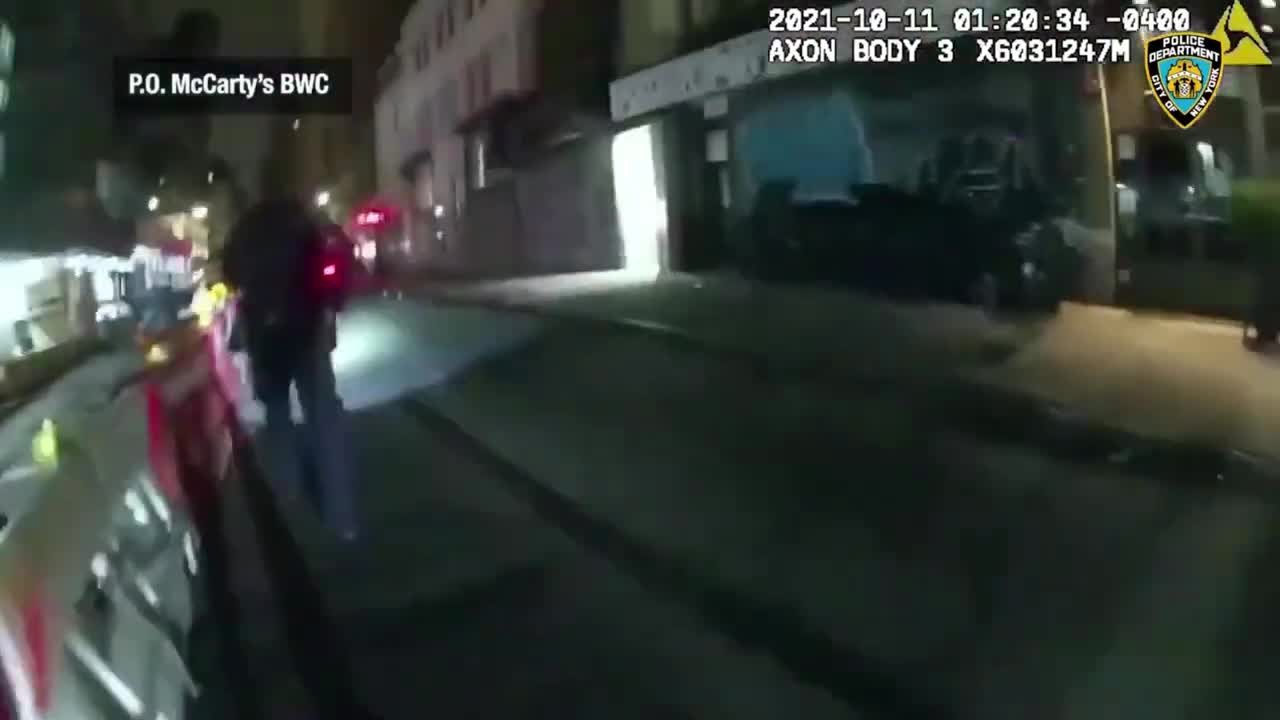 Security cam catches NYPD officer firing at BMW used in high-end robbery