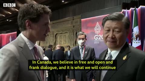 China and Canada leaders caught having tense exchange on camera - BBC News