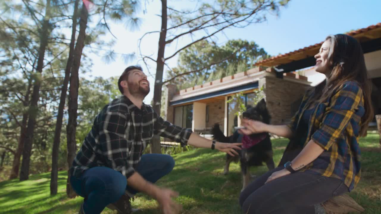 Family playing with their dog