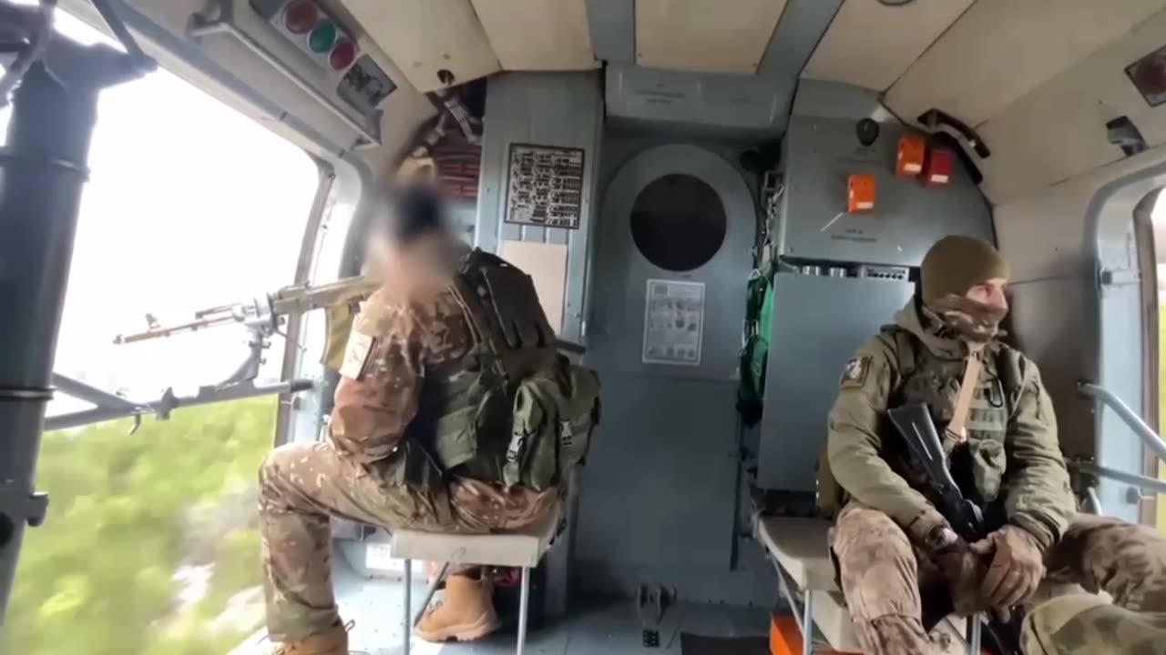 Search and rescue team specialists on a helicopter working