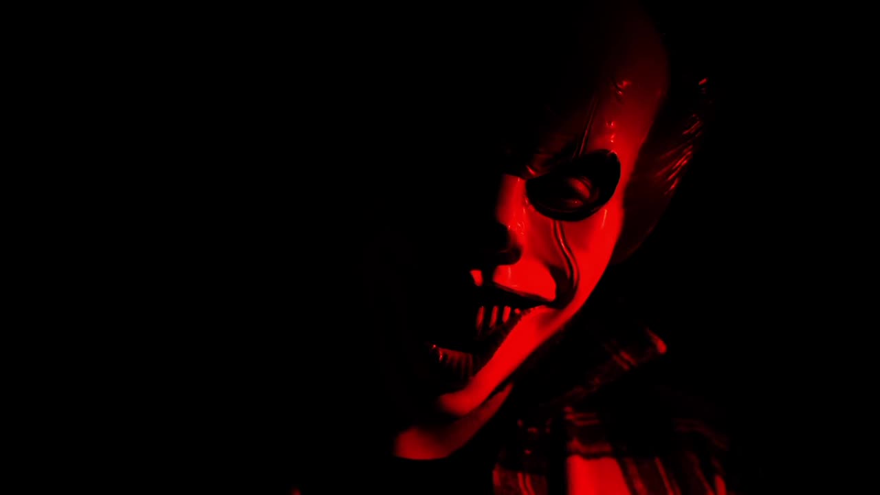 horrible horrific mask in the shadow