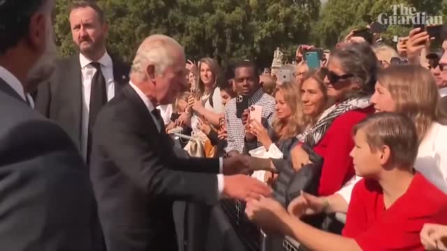 King Charles III greets crowds outside Buckingham Palace