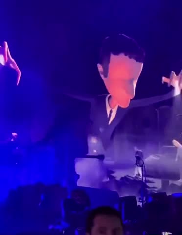 Macron depicted as a puppeteer leading the French into the abyss at the solidays festival in Paris.
