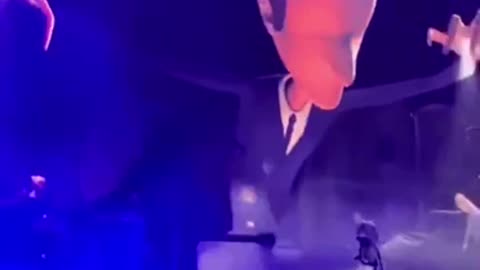 Macron depicted as a puppeteer leading the French into the abyss at the solidays festival in Paris.