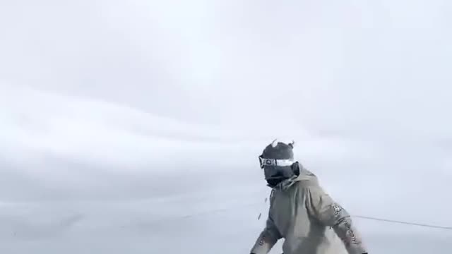 Athlete Shows Fun Tricks While Snowboarding Downhill