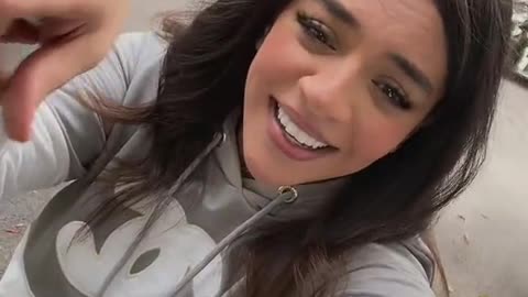 Then she came smiling, chatty