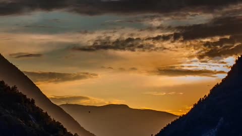 Mountains and rivers in the setting sun