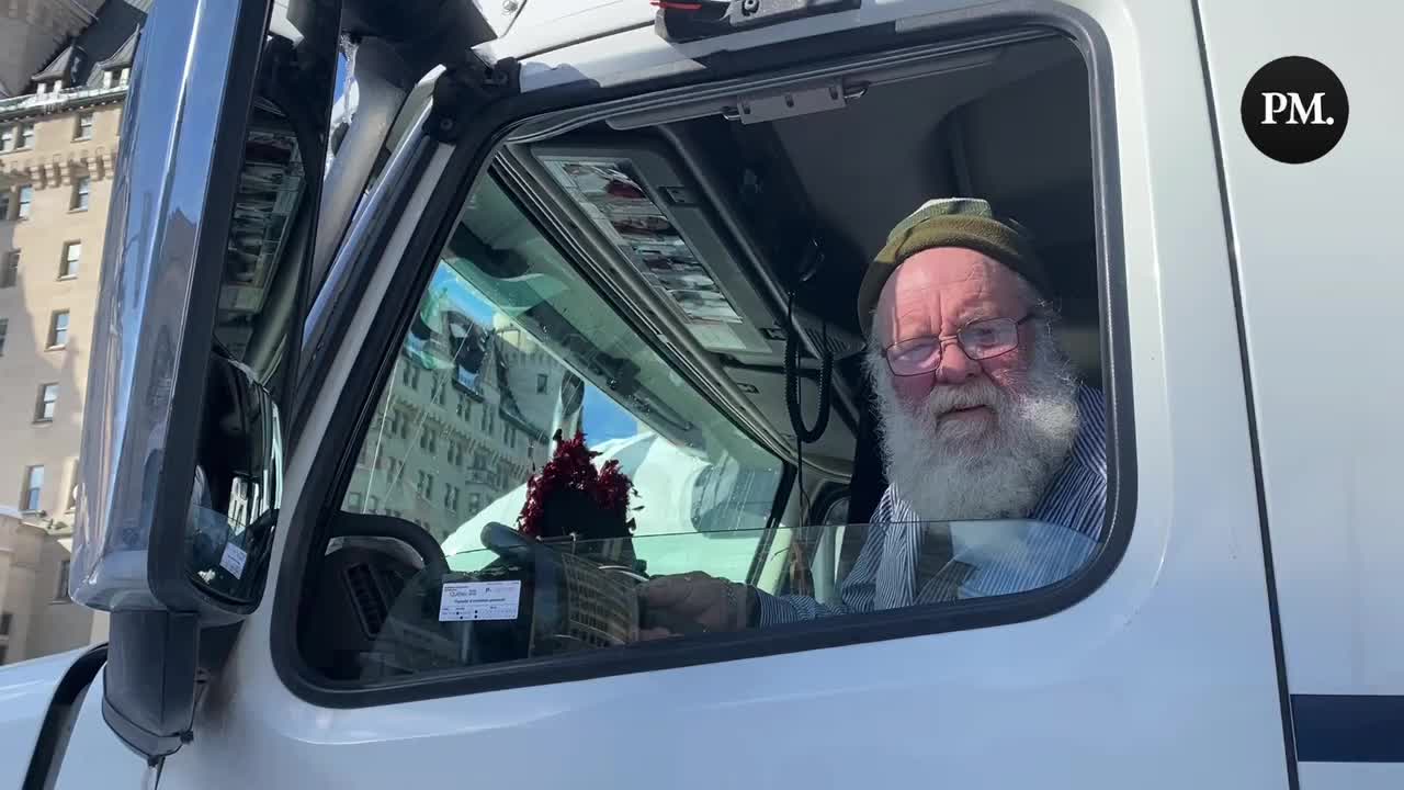 A Freedom Convoy trucker gives his thoughts as police surround his vehicle