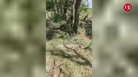 Ukrainian fighters show the equipment and soldiers which they destroyed during the counter-attack