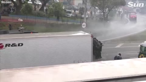 Brazilian police fire water cannons and rubber bullets at anti Lula protesters