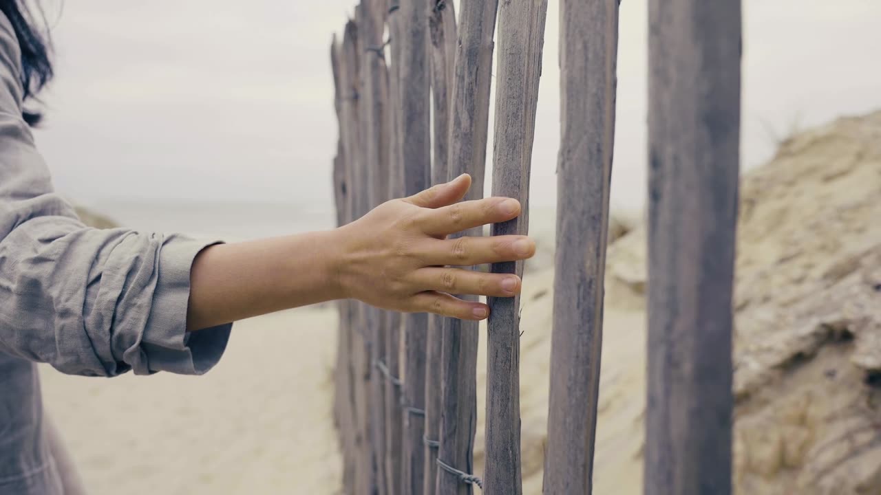 Woman hand touching woods