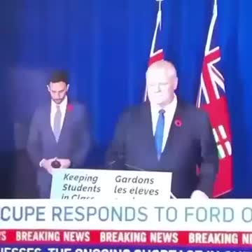 Ontario Education Minister Signals To His Handlers