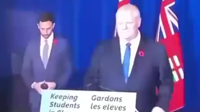 Ontario Education Minister Signals To His Handlers