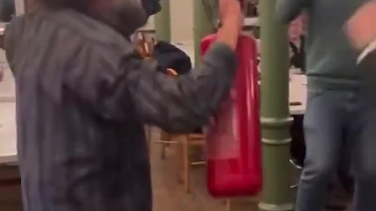 Jewish men dance with fire extinguisher poking fun at Polish MP