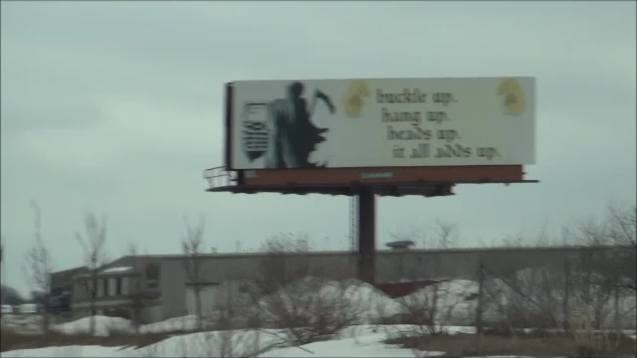 Grim Reaper Says No Reading Signs When Driving