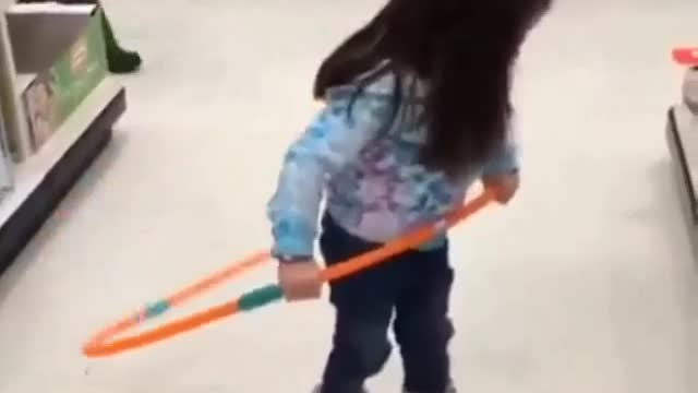The little girl hula hoop