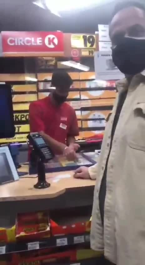 USA - Angry man verbally abuses a woman in a store for not wearing a mask