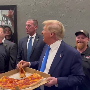 Trump Shows Off His Charisma, Hands Out Pizza To Supporters
