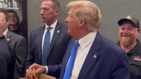 Trump Shows Off His Charisma, Hands Out Pizza To Supporters